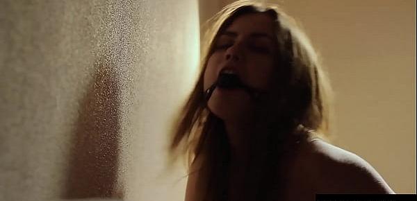  Muffling her screams with a ballgag as she dildos her wet pussy